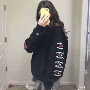 Champion black hoodie with logos on the arms/hood